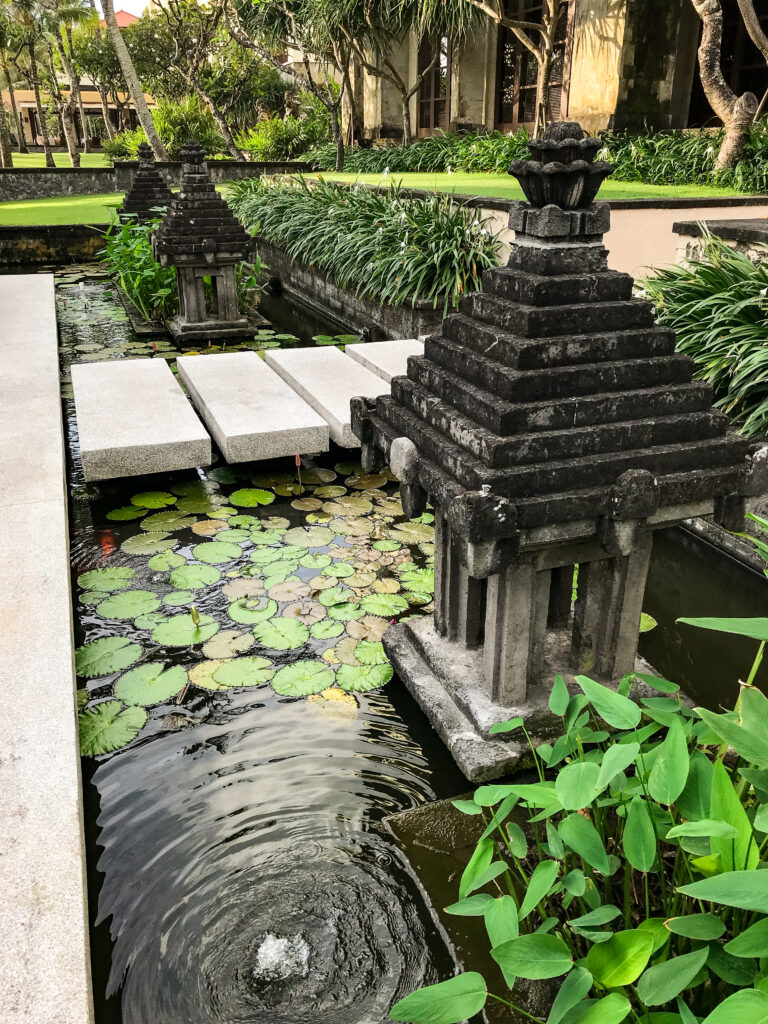 Miniature Balinese temples set in tranquil pools at The Legian hotel in Bali. © copyright Matthew Brace