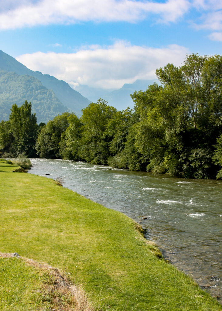 The Ossau river with its origin, the Pyrenees, in the distance. © copyright Matthew Brace