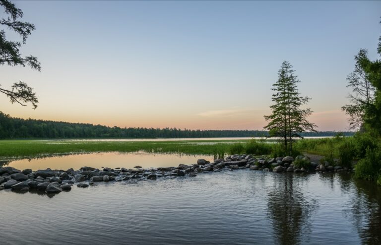 Dawn over Lake Itasca and the headwaters of the Mississippi River in Minnesota. © copyright Leslie Hough for Explore Minnesota