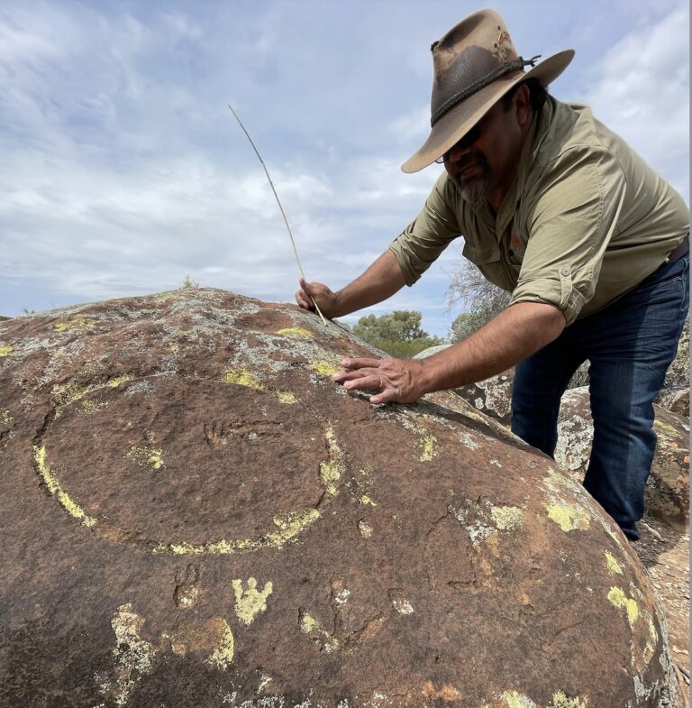 Kristian Coulthard explaining the stories behind the rock art in the magnificent Flinders Ranges, South Australia